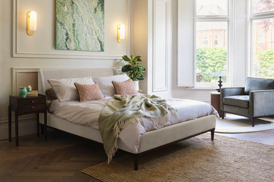 Bed in a sunlit room