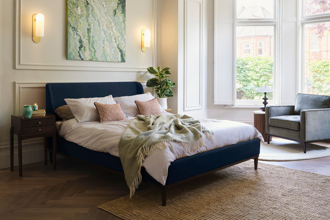 Upholstered bed in a sunlit room