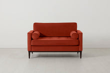 Loveseat in orange velvet